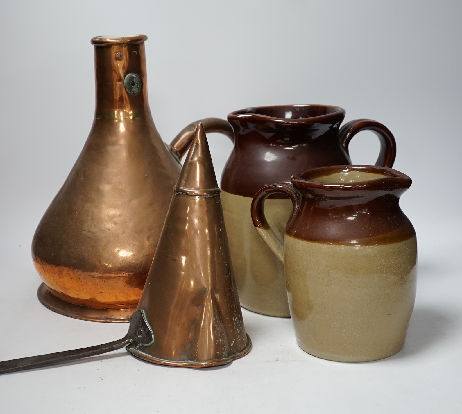 A group of 19th to early 20th century copper vessels, utensils and graduated brass weights (21)
